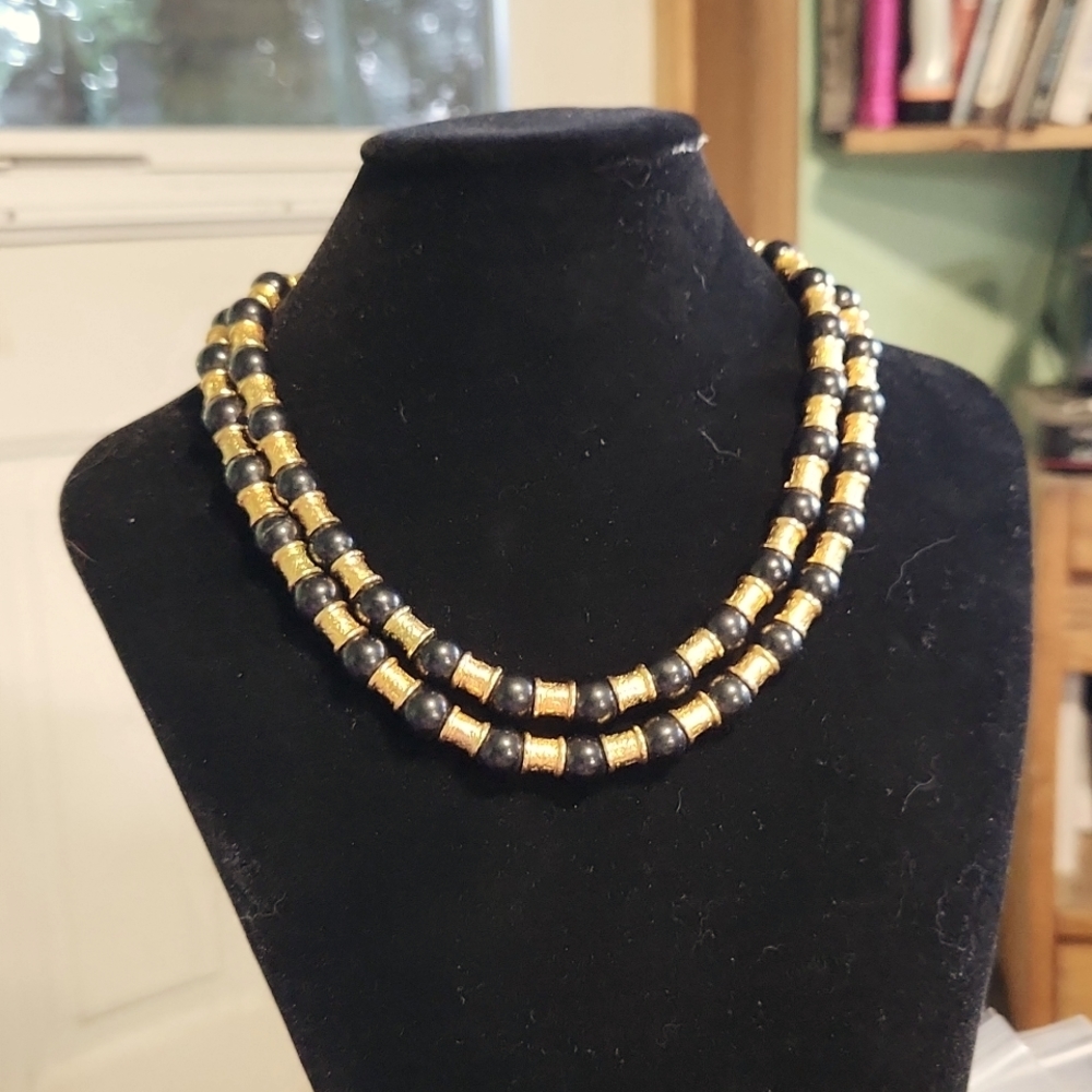 Double strand black glass and metal beads necklace. Shortest strand is 12" long.